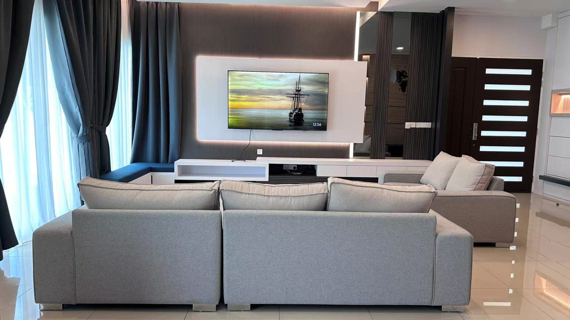 Lounge with grey sofas and ambient lighting